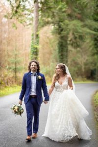 Couple walking in park on wedding day - Luxury Wedding Photography - Pink Lime Studios