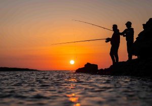 Mark & Caroline Minshall - About Pink Lime Studios - Family fishing at dusk