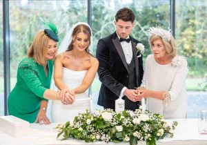 Autumn Wedding Photos - Lighting candles at a wedding - Pink Lime Studios, Wedding Photographer Sligo