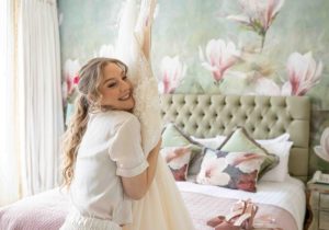 One Fab Day Magazine Feature - Bride hugging wedding dress - Pink Lime Studios Wedding Photography
